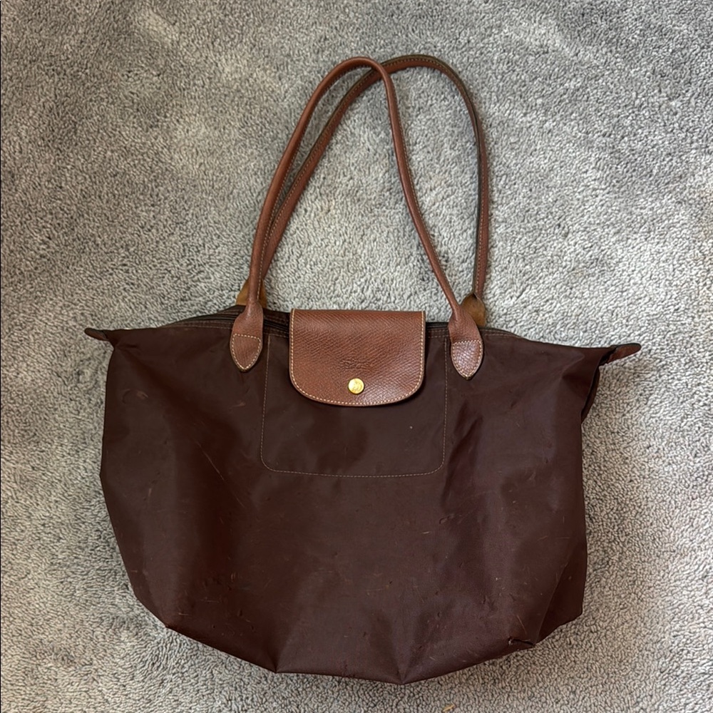 Longchamp Brown Tote Bag with Leather Handles and Foldable Design